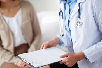 patient-consulting-with-doctor-for-exam