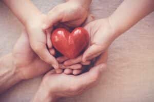 hands-holding-plastic-heart